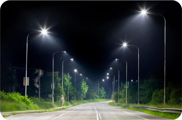 A street lit up with street lights at night